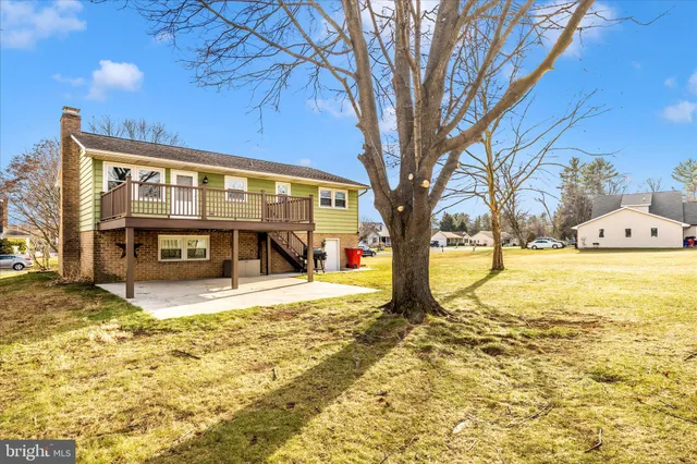 a view of a house with snow on the tree