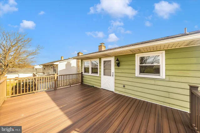 a view of a house with wooden deck