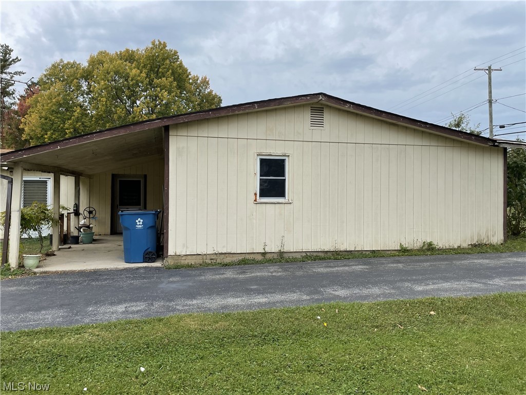 4107 Jaeger Road Lorain, OH 44053 - Photo 28 of 33 View of property exterior featuring a lawn and porch