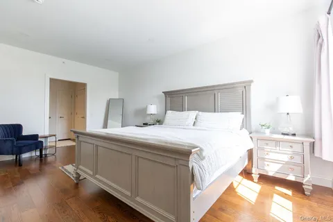 a bedroom with a bed and a table in it