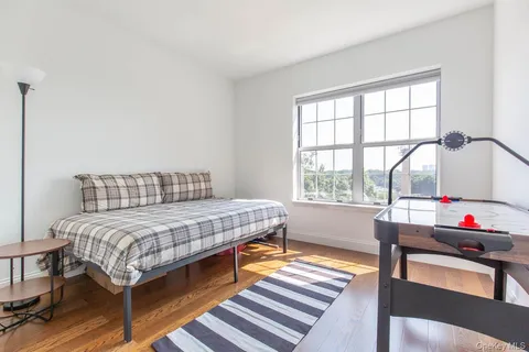 a bedroom with furniture and a window