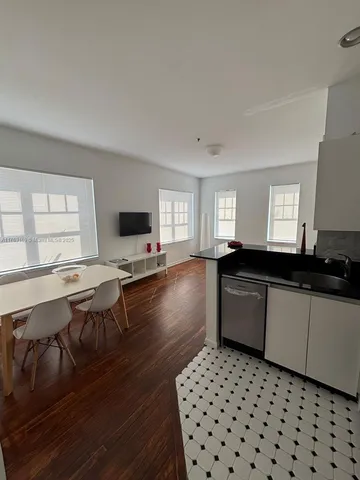 a large kitchen with a large window and counter space