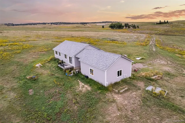 a aerial view of a house with a lake view
