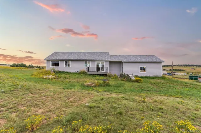 a view of a lake with a big yard