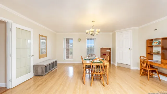 a bathroom with a granite countertop sink a toilet a mirror and bathtub
