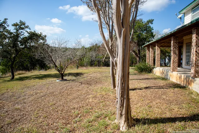 a kitchen with stainless steel appliances granite countertop a stove and cabinets