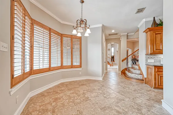 a view of an entryway with wooden floor and door