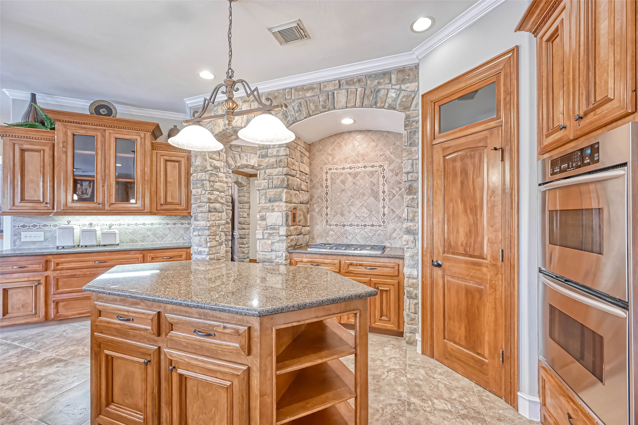 13815 Nathan Ridge Lane Cypress, TX 77429 - Photo 17 of 49 a kitchen with a refrigerator a sink and cabinets