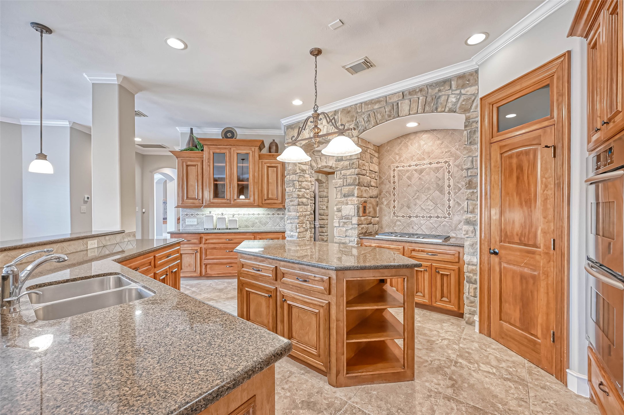 13815 Nathan Ridge Lane Cypress, TX 77429 - Photo 18 of 49 a kitchen with stainless steel appliances granite countertop a sink and a refrigerator