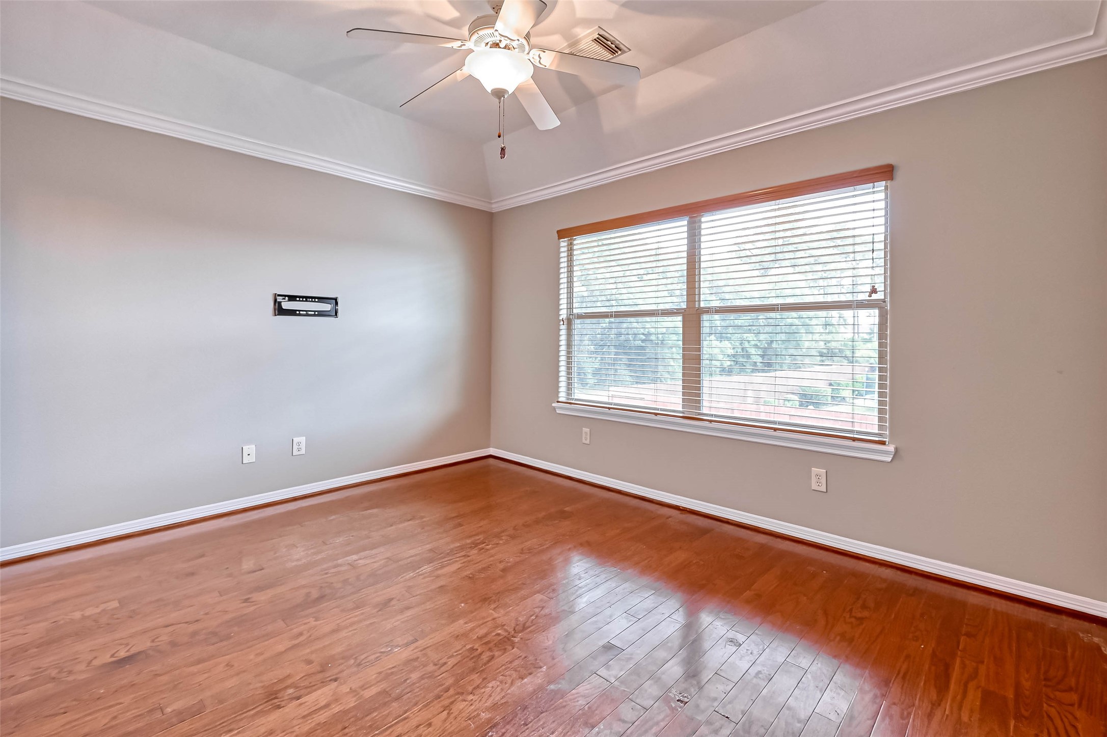 13815 Nathan Ridge Lane Cypress, TX 77429 - Photo 25 of 49 a view of an empty room with wooden floor and a window