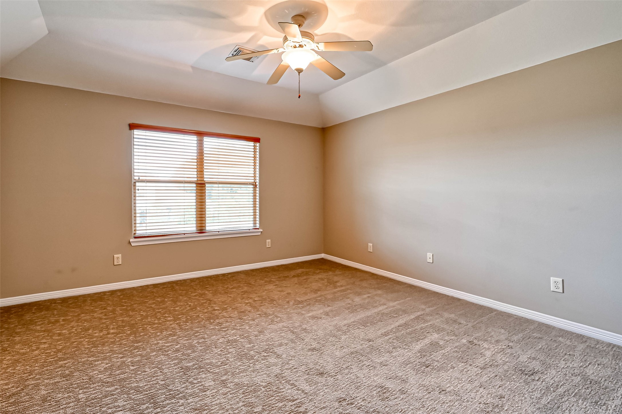 13815 Nathan Ridge Lane Cypress, TX 77429 - Photo 27 of 49 an empty room with windows and fan