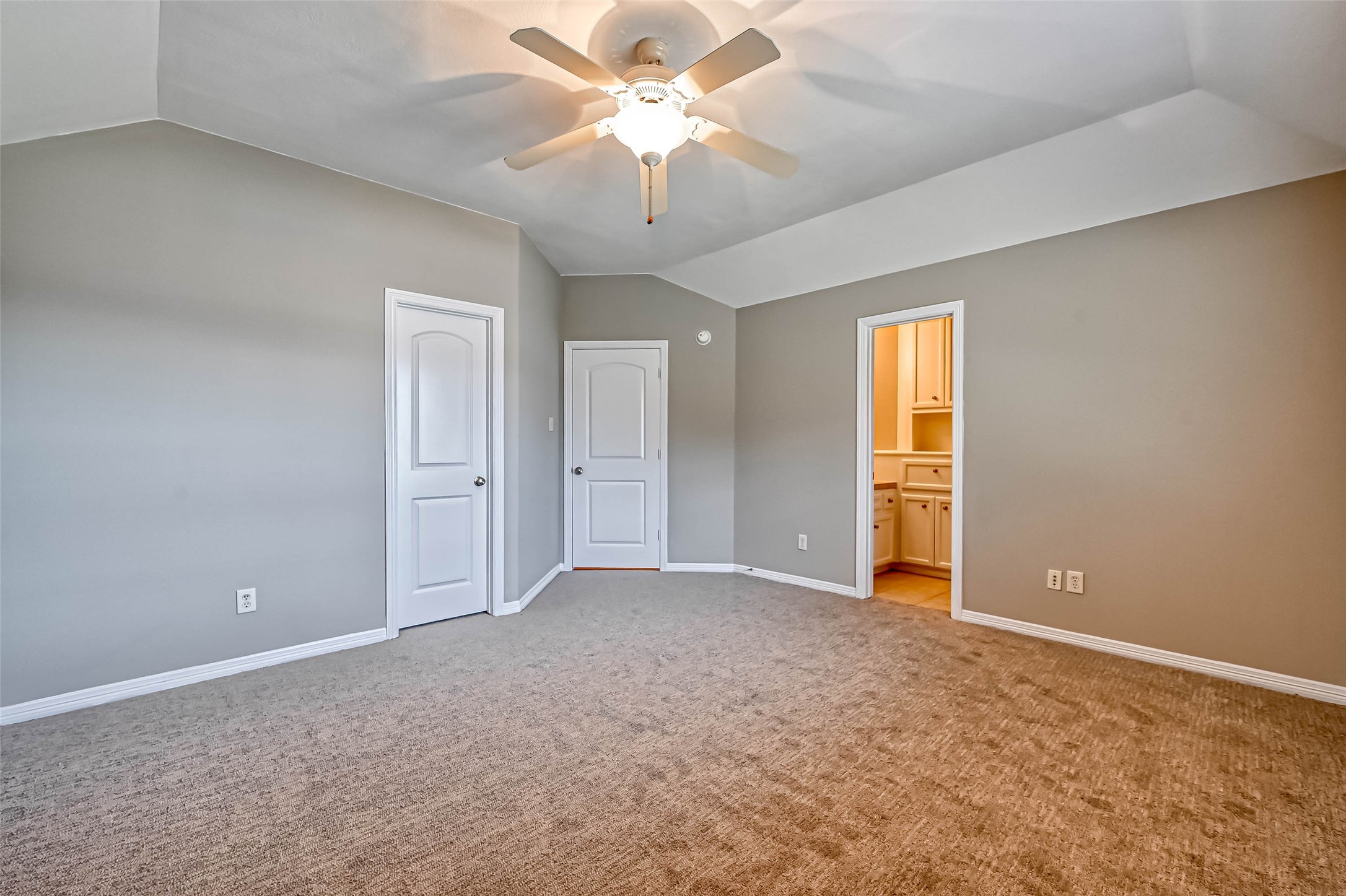 13815 Nathan Ridge Lane Cypress, TX 77429 - Photo 28 of 49 an empty room with a chandelier fan and windows
