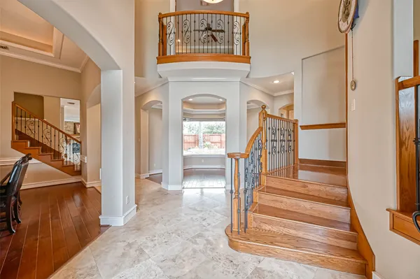 a view of entryway and hall with wooden floor