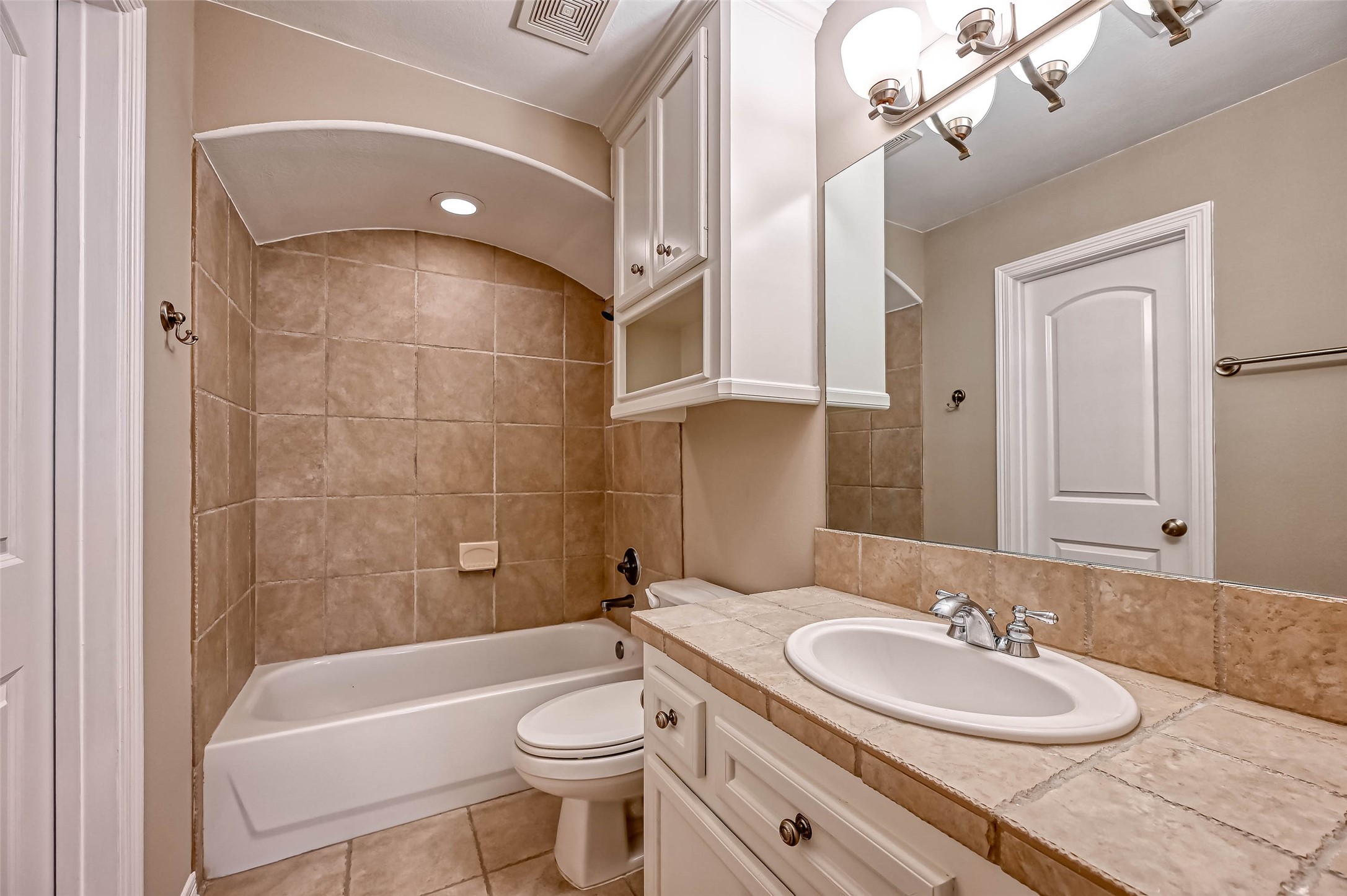 13815 Nathan Ridge Lane Cypress, TX 77429 - Photo 32 of 49 a bathroom with a sink a toilet and bathtub