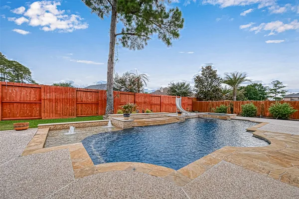 a view of a swimming pool with a lounge chair