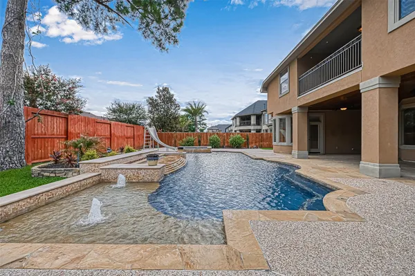 a view of a swimming pool with a patio