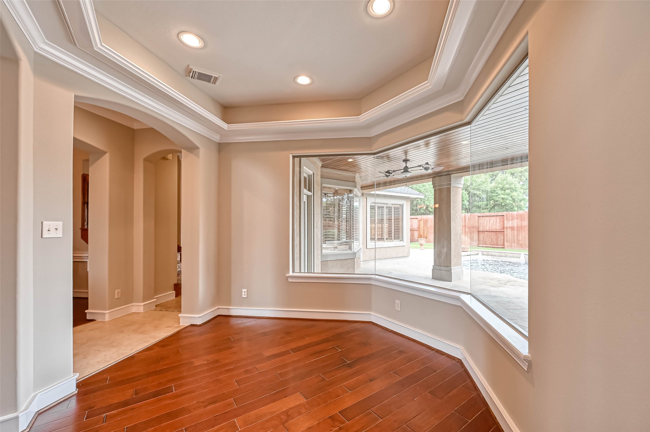 13815 Nathan Ridge Lane Cypress, TX 77429 - Photo 9 of 49 a view of an empty room with wooden floor and a window