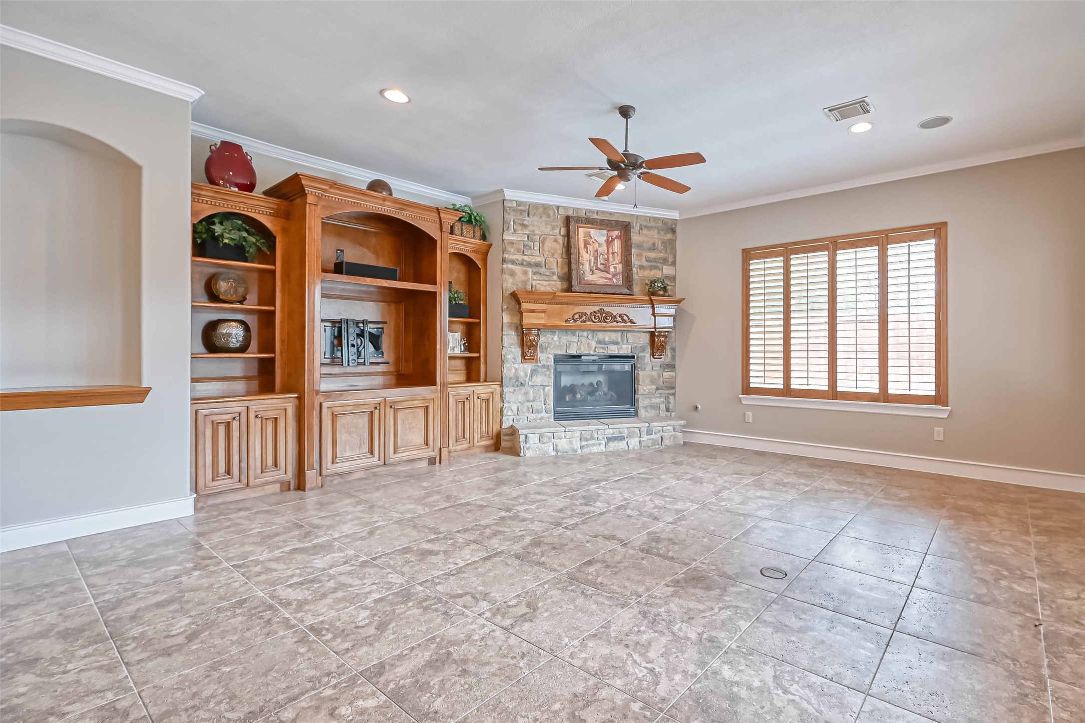 13815 Nathan Ridge Lane Cypress, TX 77429 - Photo 10 of 49 a view of an empty room with a fireplace and a window