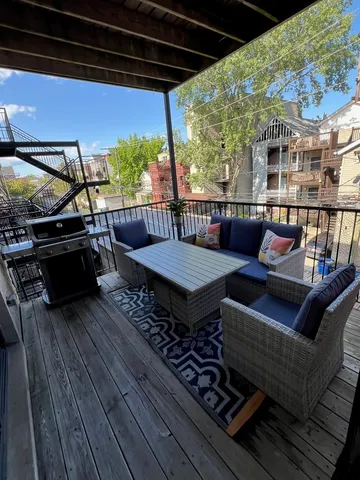 a balcony with wooden floor