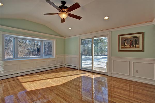 45 Gregory Road Framingham, MA 01701 - Photo 13 of 27 a view of an empty room with a window and wooden floor