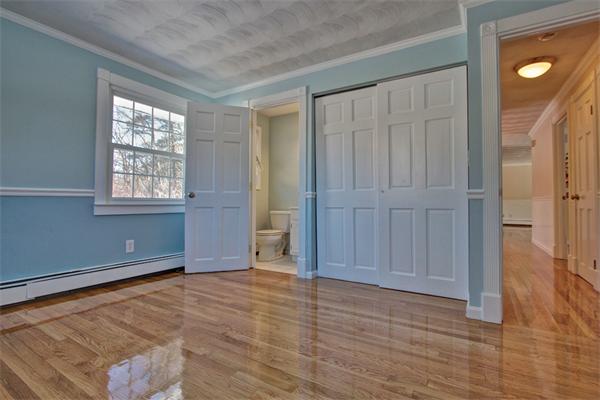 45 Gregory Road Framingham, MA 01701 - Photo 19 of 27 an empty room with wooden floor and windows