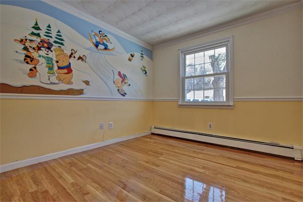 45 Gregory Road Framingham, MA 01701 - Photo 23 of 27 an empty room with a window and wooden floor