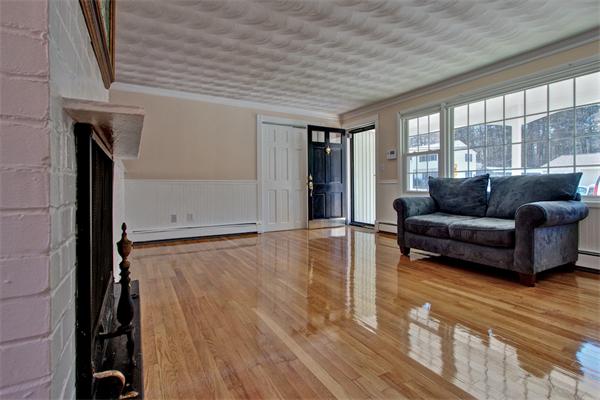 45 Gregory Road Framingham, MA 01701 - Photo 5 of 27 a living room with furniture and a large window
