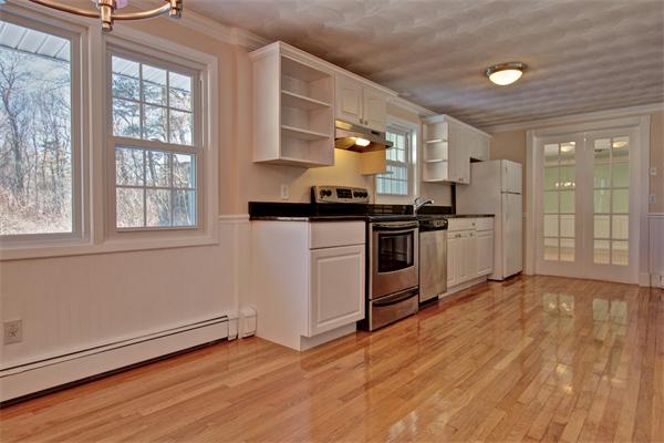 45 Gregory Road Framingham, MA 01701 - Photo 9 of 27 a kitchen with stainless steel appliances granite countertop a stove and a refrigerator