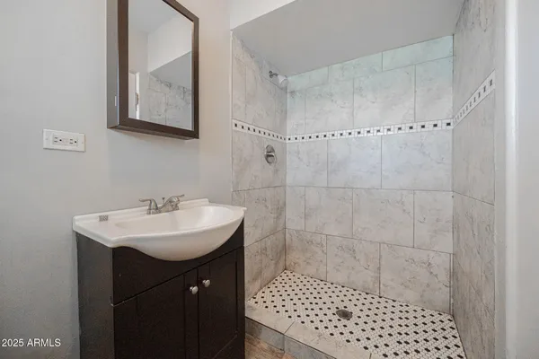 a bathroom with a sink and a mirror