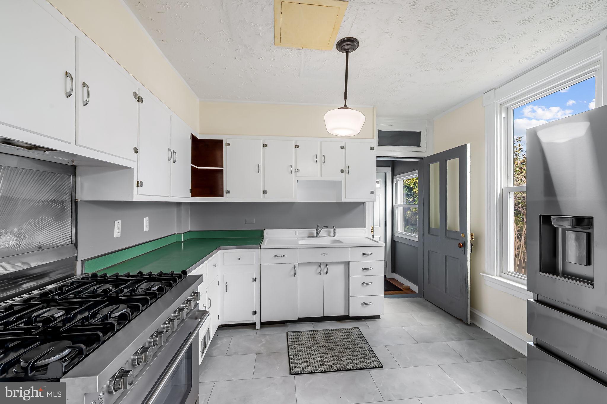 304 West Cold Spring Lane Baltimore, MD 21210 - Photo 11 of 34 Bright and airy kitchen with charm.