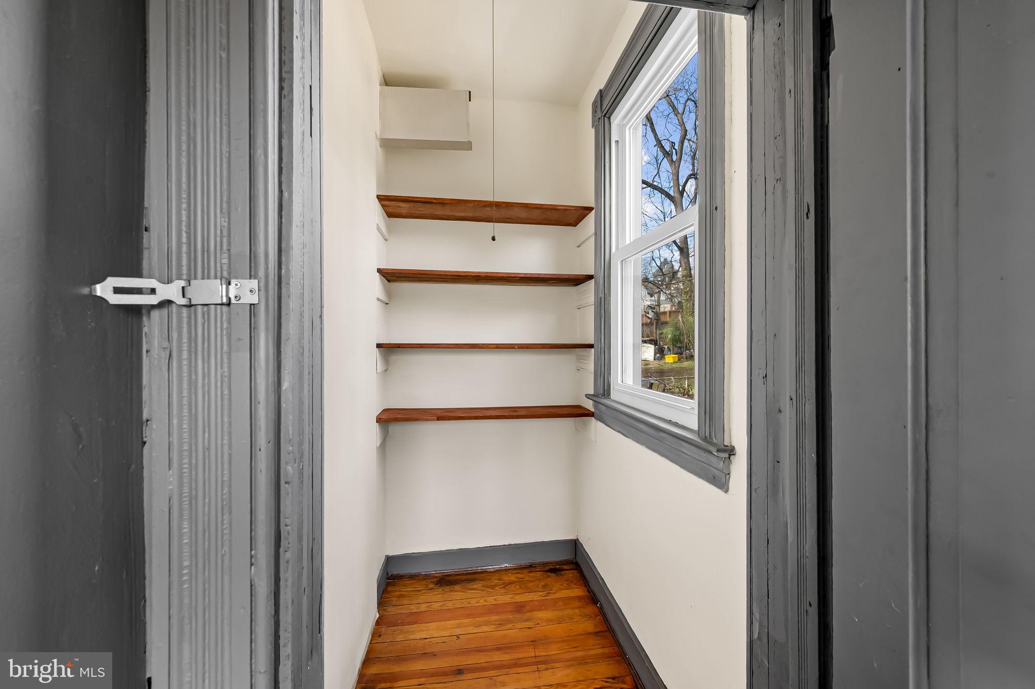 304 West Cold Spring Lane Baltimore, MD 21210 - Photo 16 of 34 Bright, airy storage nook with shelves.