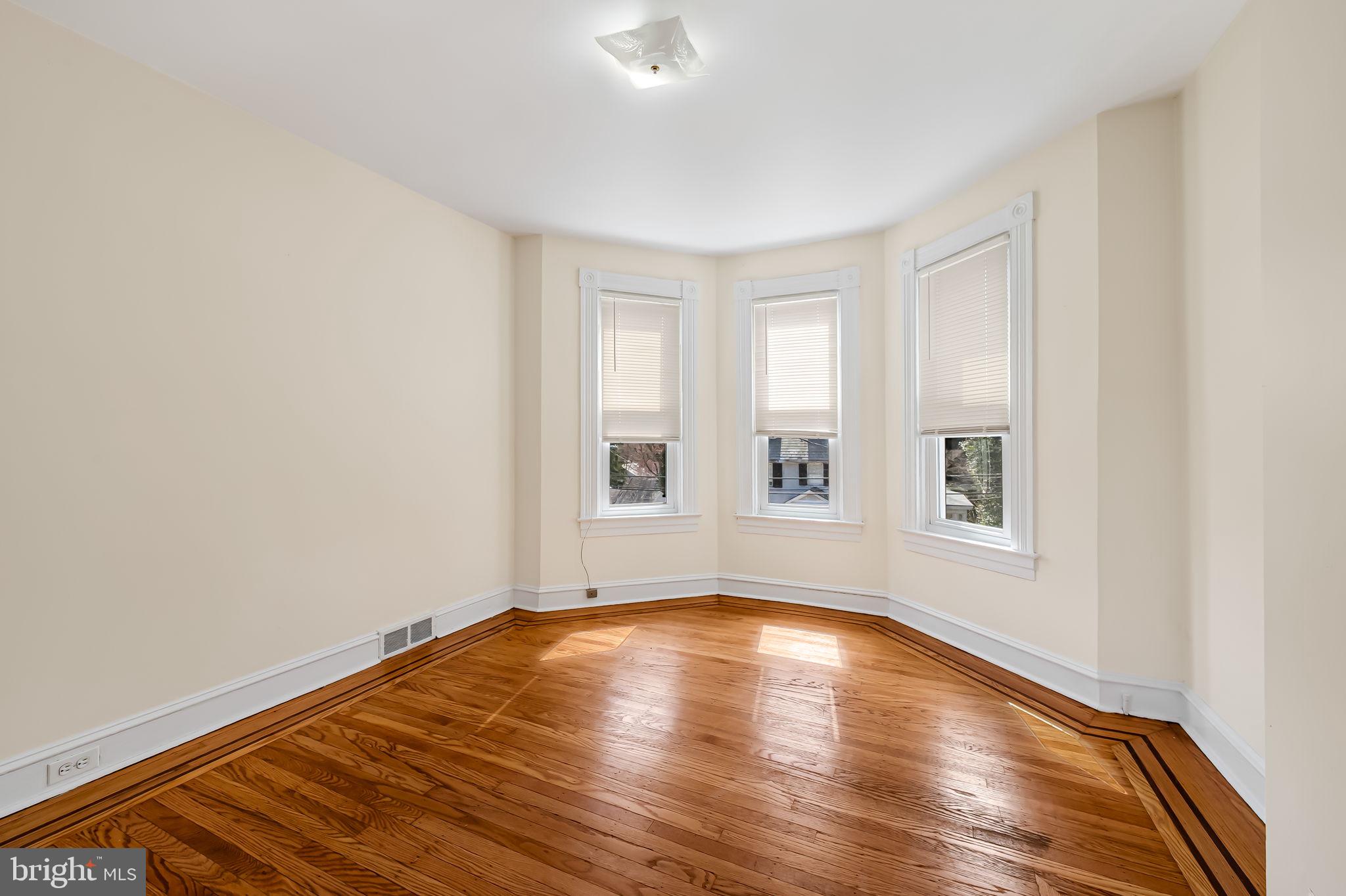 304 West Cold Spring Lane Baltimore, MD 21210 - Photo 19 of 34 Bright, airy corner room with charm.
