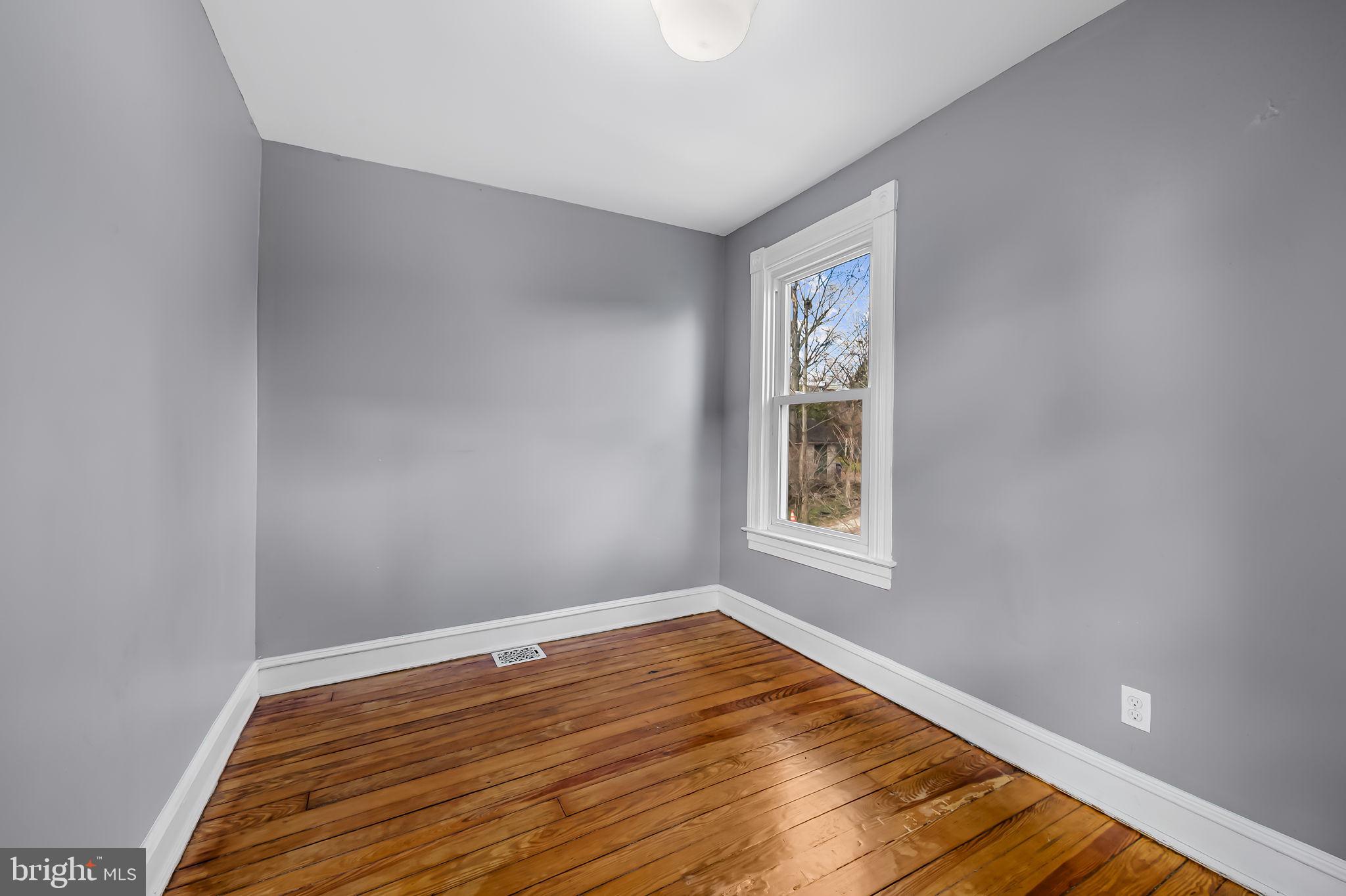 304 West Cold Spring Lane Baltimore, MD 21210 - Photo 23 of 34 Bright, airy room with classic charm.
