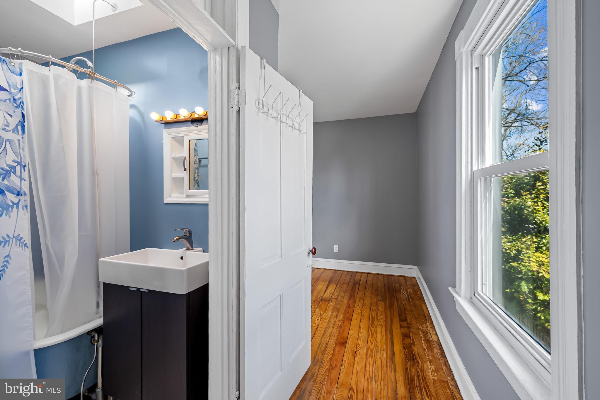 304 West Cold Spring Lane Baltimore, MD 21210 - Photo 25 of 34 Bright and airy bathroom retreat.
