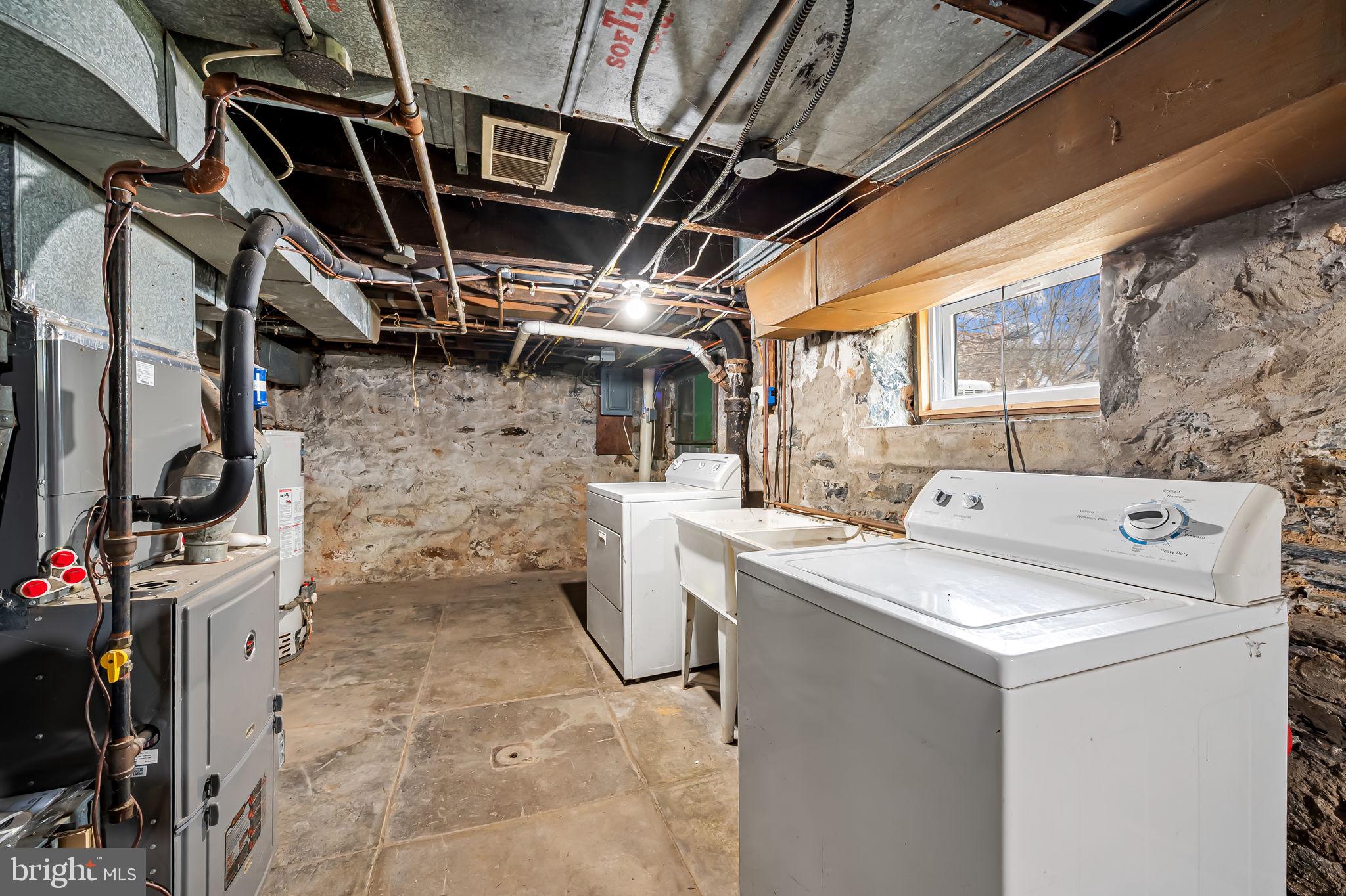 304 West Cold Spring Lane Baltimore, MD 21210 - Photo 28 of 34 Spacious basement laundry area.