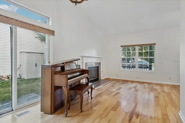 a room with a window and wooden floor