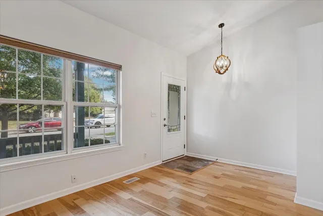 a view of empty room with windows