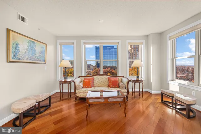 a kitchen with stainless steel appliances a stove a sink a microwave a refrigerator and cabinets