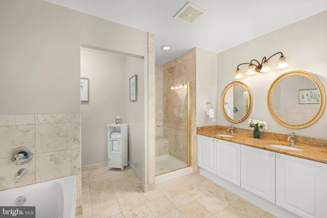 a bathroom with a bathtub and a shower