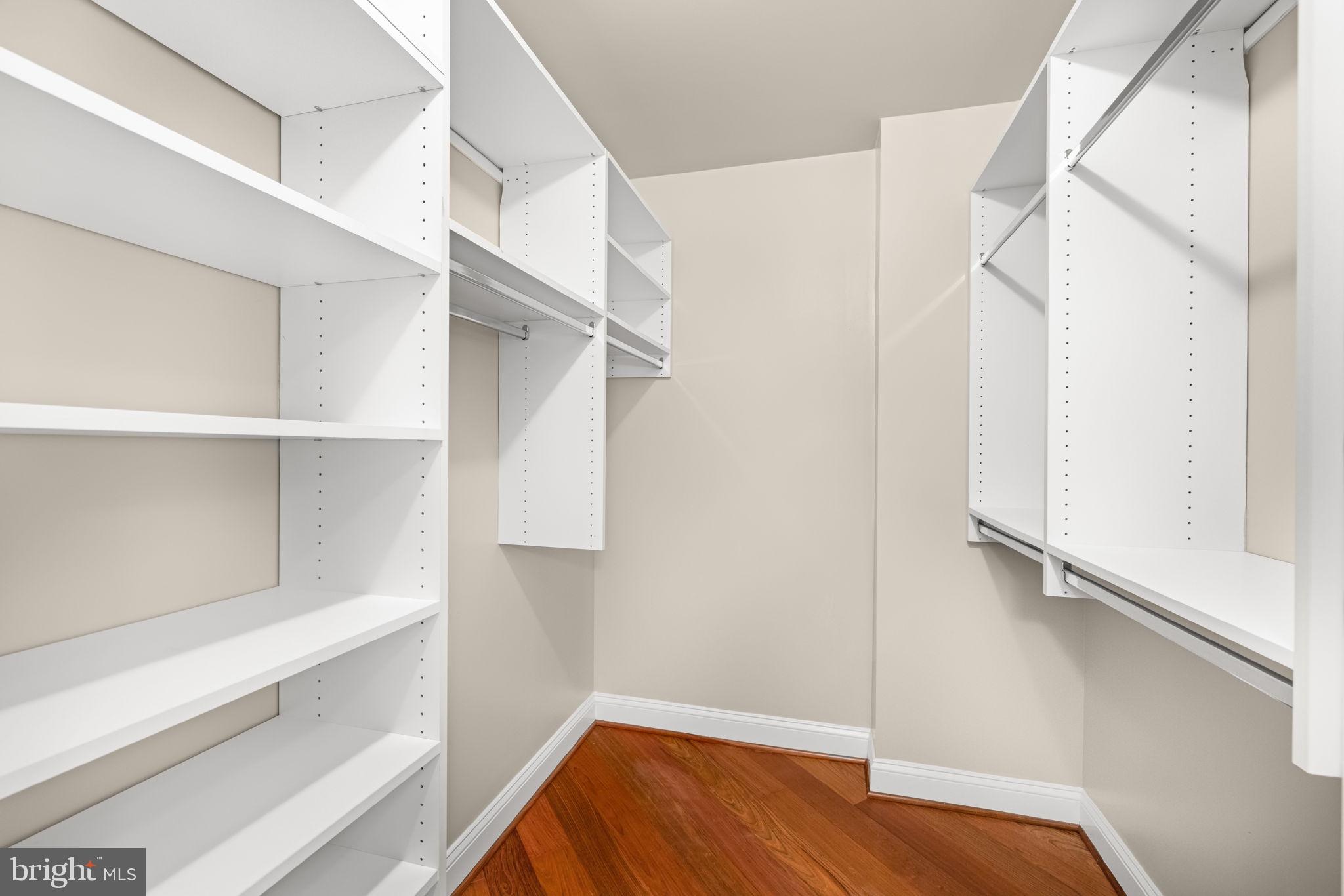 11776 Stratford House Place, Unit 907 Reston, VA 20190 - Photo 22 of 38 a view of walk in closet with empty racks
