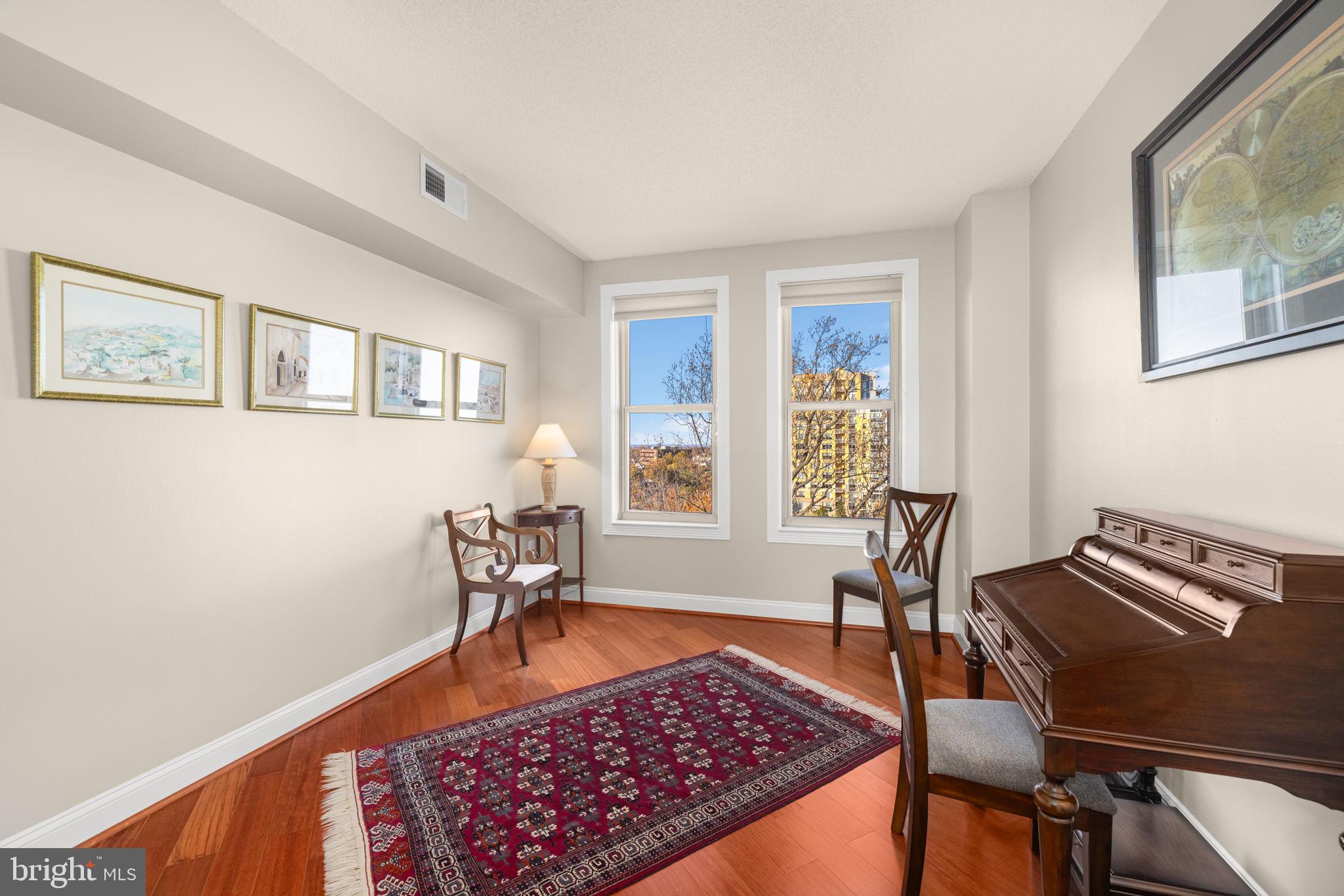 11776 Stratford House Place, Unit 907 Reston, VA 20190 - Photo 26 of 38 a living room with furniture and a window