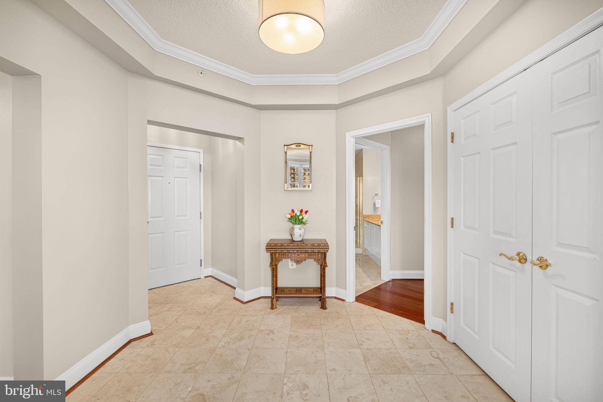 11776 Stratford House Place, Unit 907 Reston, VA 20190 - Photo 3 of 38 wooden floor and chair in a room