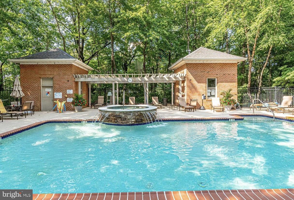 11776 Stratford House Place, Unit 907 Reston, VA 20190 - Photo 36 of 38 a view of a house with swimming pool and sitting area