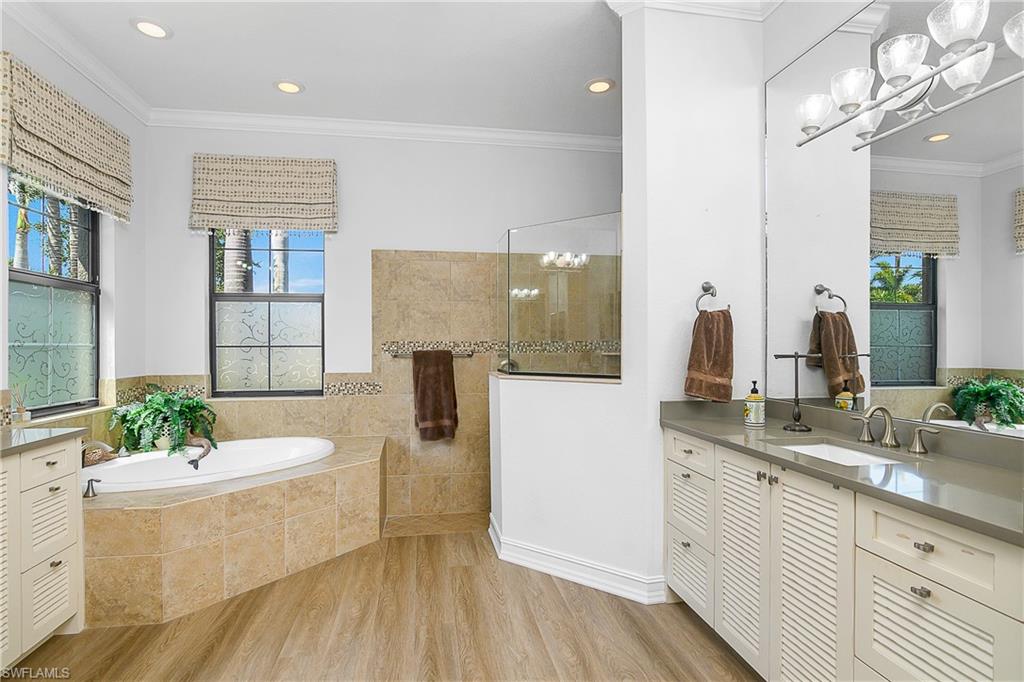 9489 Italia Way Naples, FL 34113 - Photo 17 of 50 a living room with furniture and a chandelier