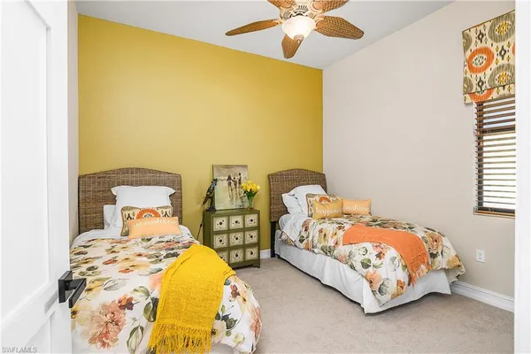 a bedroom with double bed and a window