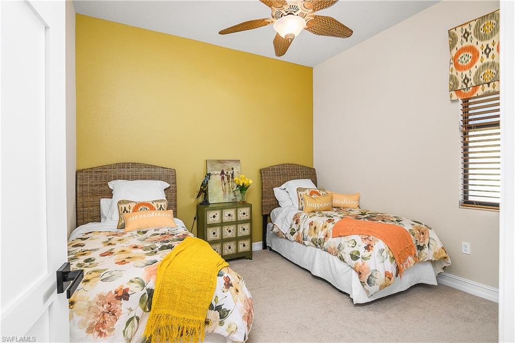 9489 Italia Way Naples, FL 34113 - Photo 19 of 50 a bedroom with double bed and a window