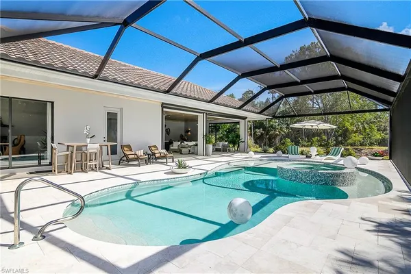 a view of a swimming pool with a patio