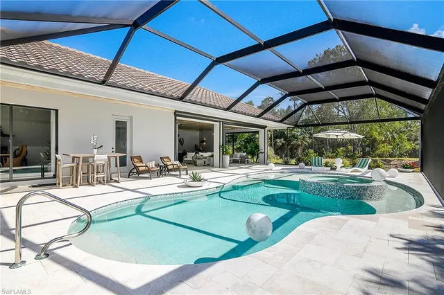 a view of a swimming pool with a patio