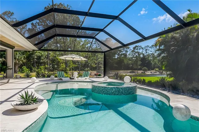 a view of a swimming pool with a patio
