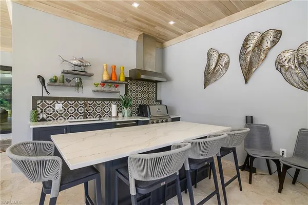 a kitchen with a table and chairs